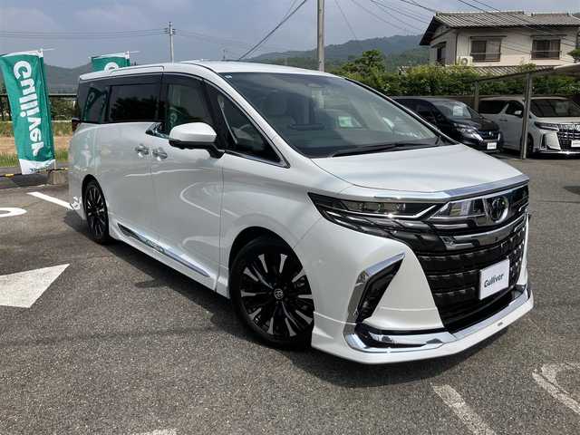 トヨタ アルファードハイブリット エグゼクティブ ラウンジ 広島県 2024(令6)年 1.4万km プラチナホワイトパールマイカ ワンオーナー/左右独立ムーンルーフ/ベージュレザーシート/メーカーナビ・JBLサウンドシステム/リアエンターテイメントシステム/フルセグTV/3眼LEDヘッドライト・シーケンシャルウィンカー/パノラミックビューモニター/セーフティセンス・BSM/デジタルインナーミラー/エグゼディブラウンジシート/1列目・2列目パワーシート/1列目・2列目エアーシート・シートヒーター/トヨタチームメイト・リモート機能付き/ブラインドスポットモニター/ユニバーサルステップ/オプション19インチアルミホイール/モデリスタエアロパーツキット/モデリスタフロントグリル/モデリスタシグネチャーイルミブレード/モデリスタフードガーニッシュ