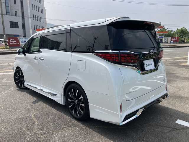 トヨタ アルファードハイブリット エグゼクティブ ラウンジ 広島県 2024(令6)年 1.4万km プラチナホワイトパールマイカ ワンオーナー/左右独立ムーンルーフ/ベージュレザーシート/メーカーナビ・JBLサウンドシステム/リアエンターテイメントシステム/フルセグTV/3眼LEDヘッドライト・シーケンシャルウィンカー/パノラミックビューモニター/セーフティセンス・BSM/デジタルインナーミラー/エグゼディブラウンジシート/1列目・2列目パワーシート/1列目・2列目エアーシート・シートヒーター/トヨタチームメイト・リモート機能付き/ブラインドスポットモニター/ユニバーサルステップ/オプション19インチアルミホイール/モデリスタエアロパーツキット/モデリスタフロントグリル/モデリスタシグネチャーイルミブレード/モデリスタフードガーニッシュ
