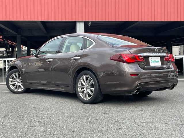 日産 フーガ ハイブリッド 神奈川県 2021(令3)年 7.6万km 茶Ｍ 純正HDDナビ/・DTV/CD/DVD/MSV/BT/USB							/アランドビューモニター/BOSEサウンドシステム/レザーシート/前席シートヒーター/エアシート/前席パワーシート/助手席パワーオットマン機構/ビルトインETC/インテリジェントエマージェンシーブレーキ/インテリジェントクルーズコントロール/車線逸脱防止支援システム/後側方衝突防止支援システム/後退時衝突防止支援システム		/革巻きステアリング				/純正18インチAW/オートライト/純正LEDヘッドライト				/フォグランプ			/プッシュEgスタート/ストップ				/インテリジェントキー×2					/ターンランプ付電動格納ドアミラー/純正フロアマット/取扱説明書/ナビ取扱説明書/整備手帳