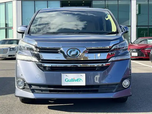 トヨタ ヴェルファイア ハイブリット X 愛媛県 2016(平28)年 6.4万km グレイッシュブルーマイカメタリック アルパイン製ナビ/BT/AM・FM/CD/DVD/フルセグTV/アルパイン製後席モニター/ビルトインETC/ドライブレコーダー/クルーズコントロール/パーキングアシスト/バックカメラ/両側パワースライドドア/8人乗り/オットマン/サンルーフ/純正アルミホイール/純正フロアマット