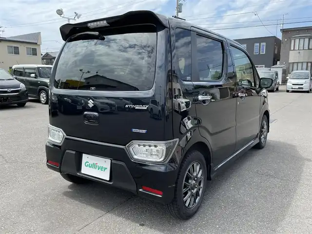スズキ ワゴンＲ スティングレー HYBRID T 道央・札幌 2017(平29)年 10.8万km ブルーイッシュブラックパール3 登録時走行距離107772ｋｍ/　４　Ｗ　Ｄ　/寒冷地仕様/ターボ車/純正メモリナビ（CD/DVD/FM/AM/BT/USB)/フルセグ(走行中視聴可)/バックカメラ/全周囲カメラ/アイドリングストップ/ウィンカーミラー/クルーズコントロール（追従走行なし）/プッシュスタート/MTモード付AT/パドルシフト/ベンチシート/純正フロアマット/シートヒーター（運転席/助手席）/横滑り防止装置/レーンキープアシスト/盗難防止装置/オートライト/オートマチックハイビーム/衝突軽減ブレーキ/フォグランプ/ステアリングスイッチ/革巻きステアリング/イルミネーションコントロール/ヘッドアップディスプレイ/電動格納ミラー/積込夏タイヤ（純正AW/165/55/R15/21年製/溝4ｍｍ）