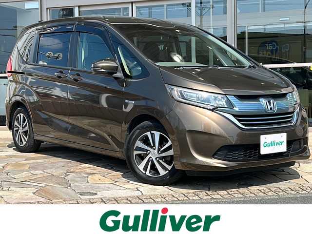 ホンダ フリード＋ ハイブリット EX 静岡県 2016(平28)年 14万km マンダリンゴールドM 純正ナビ/・FM/・AM/・CD/DVD/・USB/・iPod/・Bluetooth/・スマートフォン連携/・フルセグTV/・HDMI/ホンダセンシング/●衝突軽減ブレーキ〈CMBS〉/●誤発進抑制機能/●ACC〈アダプティブ・クルーズ・コントロール〉/●LKAS〈車線維持支援システム〉/●歩行者事故低減ステアリング/●路外逸脱抑制機能/●先行車発進お知らせ機能/●標識認識機能/主要装備/・バックカメラ/・ＬＥＤヘッドライト/・両側パワースライドドア/・運転席+助手席シートヒーター/・横滑り防止装置/・ＥＴＣ/・オートライト/・追従クルコン/・サイドカーテンエアバッグ