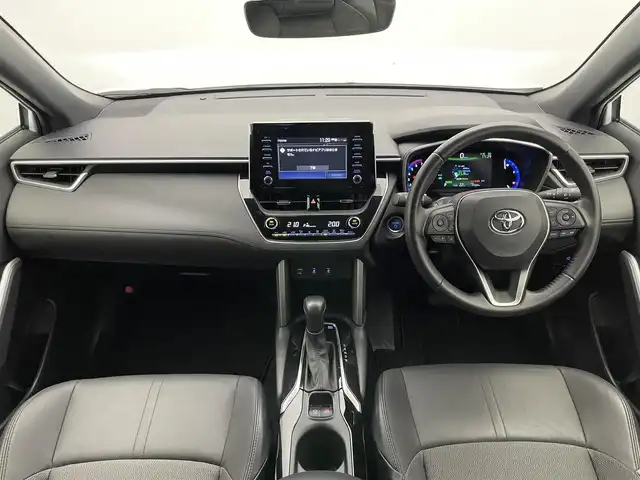 トヨタ カローラ クロス ハイブリッド Z 愛知県 2023(令5)年 1.8万km プラチナホワイトパールマイカ 純正８型ＤＡ　全方位カメラ　ＢＳＭ　禁煙車　セーフティセンス　衝突軽減　追従クルコン　ＬＥＤオートライト　黒ハーフレザー　シートヒーター　電動リヤゲート　レーンキープ　スペアタイヤ　プッシュスタート　スマートキー　電子パーキング　ブレーキホールド　カーテンエアバッグ　純正アルミホイール　純正フロアマット　USBポート　Bluetooth