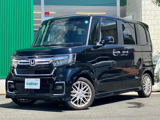 ホンダ Ｎ ＢＯＸ カスタム L ターボ 静岡県 2021(令3)年 3.8万km クリスタルブラックパール エンジンスタートボタン/取扱説明書/パワーステアリング/パワーウィンドウ/パドルシフト/アイドリングストップ/スマートキー/スペアキー1本/オートエアコン/クルーズコントロール/USB入力端子/純正ETC2.0/バックカメラ/純正ナビ（CD/DVD/BT/フルセグ）/純正ドライブレコーダー前後/ベンチシート/純正フロアマット/ハーフレザーシート/D席N席シートヒーター/両側パワースライドドア/純正アルミホイール/ABS/横滑り防止装置/コーナーセンサー/レーンキープアシスト/盗難防止装置/オートライト/オートマチックハイビーム/LEDヘッドライト/W+サイドエアバック/衝突軽減システム/カーテンエアバック/ホンダセンシング/電動パーキングブレーキ