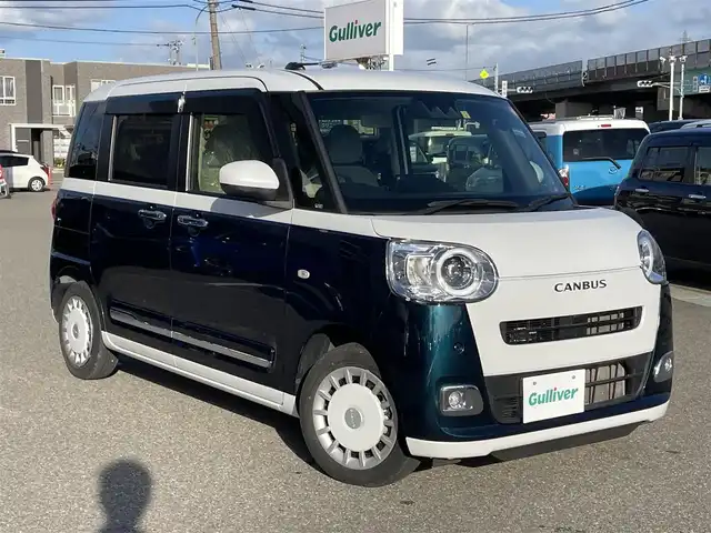 ダイハツ ムーヴ キャンバス ストライプス G 石川県 2023(令5)年 2.7万km シャイニングホワイトパール/レーザーブルークリスタルシャイン 純正メモリーナビ/純正CD/DVD/フルセグTV/バックカメラ/LEDヘッドライト/両側パワースライドドア/ETC/スマートアシスト/オートブレーキホールド/コーナーセンサー/スマートキー/プッシュスタート/電動ミラー/保証書