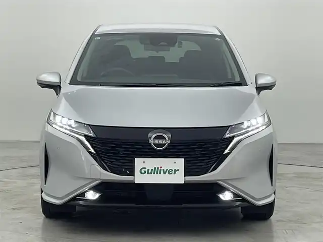 日産 オーラ G レザーエディション 広島県 2021(令3)年 1万km ブリリアントシルバー 純正９型ナビ（フルセグＴＶ）　/全方位カメラ　/デジタルルームミラー　/ＥＴＣ２．０　/前後ドラレコ　/コーナーセンサー　/エマージェンシーブレーキ　/レーンキープ　/ＢＳＭ　/ハーフレザー　/純正１７インチＡＷ　/ＬＥＤ