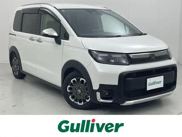 ホンダ フリード ハイブリット e:HEV クロスター 茨城県 2024(令6)年 1.7万km プラチナホワイトパール 純正11.4インチナビ/Bluetooth/フルセグ/radio/CD/DVD/マルチビューカメラシステム(OP)/ホンダセンシング/・衝突被害軽減ブレーキ/・誤発進抑制/・路外逸脱抑制機能/・渋滞追従機能付き追従型クルーズコントロール/・オートハイビーム/ブラインドスポットインフォメーション/ドラレコ/両側パワースライドドア/D+N席シートヒーター/コーナーセンサー/LEDヘッドライト/純正AW