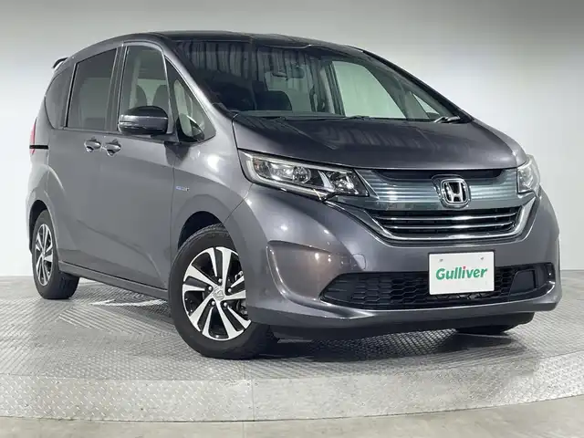 ホンダ フリード ハイブリット EX 神奈川県 2018(平30)年 4.7万km モダンスティールM 純正7型メモリーナビゲーション【VXM-184VFI】/フルセグ　CD DVD　AM FM iPod　SD　Bluetooth　AUX/バックカメラ/ホンダセンシング/衝突軽減ブレーキ/レーダークルーズコントロール/車線維持支援システム/路外逸脱抑制機能/先行車発進告知お知/標識認識機能/ハーフレザーシート/前席シートヒーター/ECON/前方ドライブレコーダー/ビルトインETC/プッシュスタート/スマートキー/純正15インチアルミホイール/LEDヘッドライト/オートライト
