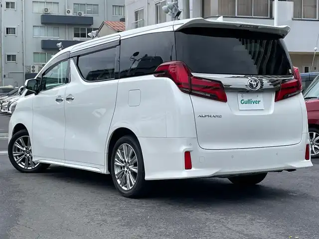 トヨタ アルファード S タイプゴールド 島根県 2021(令3)年 6.2万km ホワイトパールクリスタルシャイン ワンオーナー/純正１０インチナビ・フルセグTV　/ＤＶＤ再生・Ｂｌｕｅｔｏｏｔｈ/ビルトイン２．０ＥＴＣ/バックカメラ/ドライブレコーダー/クルーズコントロール/ハーフレザーシート/2列目オットマン/衝突軽減ブレーキ/レーンキープアシスト/両側パワースライドドア/パワーバックドア/前後コーナーセンサー/オートハイビーム/純正LEDライト/純正フォグランプ/純正フロアマット/純正インチ18アルミホイール