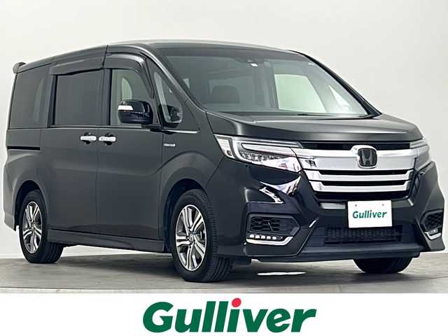ホンダ ステップワゴン スパーダ ハイブリッド G ホンダセンシング 大阪府 2018(平30)年 6.3万km プレミアムスパークルブラックパール 純正ナビ　Gathers/BT　フルセグTV　DVD再生機能/フリップダウンモニター/ETC/ドライブレコーダー前後　/バックカメラ/両側パワースライドドア/純正フロアマット/純正アルミホイール/BREAKHOLD/シートバックテーブル/クルーズコントロール/先行車発進アラーム/衝突被害軽減システム