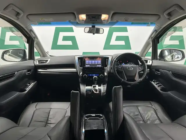 トヨタ ヴェルファイア Z 鹿児島県 2015(平27)年 6.5万km ホワイトパールクリスタルシャイン 禁煙車/純正9インチSDナビ(NSZT-Y64T)/　・Bluetooth/　・CD/DVD/　・フルセグTV/　・AM/FM/フリップダウンモニター/両側パワースライドドア/バックカメラ/ETC/電動パーキングブレーキ/ブレーキホールド/前後コーナーセンサー/後席オットマン/純正フロアマット/社外アルミホイール(huperion)/電動格納ミラー/ステアリングリモコン/全席オートパワーウィンドウ