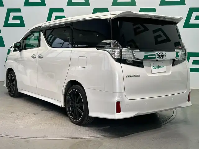 トヨタ ヴェルファイア Z 鹿児島県 2015(平27)年 6.5万km ホワイトパールクリスタルシャイン 禁煙車/純正9インチSDナビ(NSZT-Y64T)/　・Bluetooth/　・CD/DVD/　・フルセグTV/　・AM/FM/フリップダウンモニター/両側パワースライドドア/バックカメラ/ETC/電動パーキングブレーキ/ブレーキホールド/前後コーナーセンサー/後席オットマン/純正フロアマット/社外アルミホイール(huperion)/電動格納ミラー/ステアリングリモコン/全席オートパワーウィンドウ