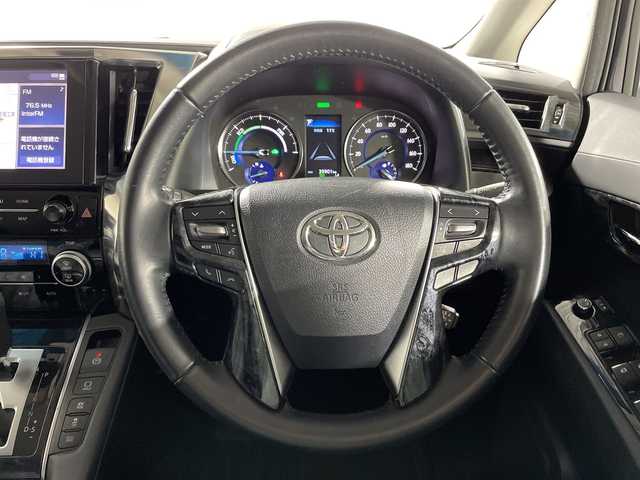 トヨタ アルファードハイブリット S 神奈川県 2020(令2)年 4万km スパークリングブラックパールクリスタルシャイン 4WD/純正ディスプレイオーディオ/コネクトナビ/CD DVD/Bluetooth　USB　Miracast/両側電動スライドドア/AC100Vコンセント/セーフティセンス/プリクラッシュセーフティ/レーントレーシングアシスト/レーンディパーチャーアラート/レーダークルーズコントロール/オートマチックハイビーム/ロードサインアシスト/パーキングサポートブレーキ/先行車発進お知らせ機能/前後ソナー/純正ビルトインETC/革巻きステアリング/2列目オットマン/社外ワイヤレス充電/EV/ECOモード/SOSコール/nanoe/社外前後ドライブレコーダー/電動パーキングブレーキ/オートブレーキオールド/プッシュスタート/スマートキー/2眼LEDヘッド/フォグランプ/オートライト/純正リアスポイラー/純正17インチアルミホイール/