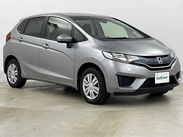 ホンダ フィット 13G Fパッケージ 道央・札幌 2015(平27)年 2.8万km ティンテッドシルバーM ・4WD/・ワンオーナー/・純正ナビ＆TV&CD&DVD&BT&SD/・バックカメラ/・衝突軽減ブレーキ/・純正ドライブレコーダー/・純正エンジンスターター/・鉄チン付きサマータイヤ積込/・フロントワイパーデアイサー/・ビルトインETC/・スマートキー/・スペアキー/・アイドリングストップ/・横滑り防止