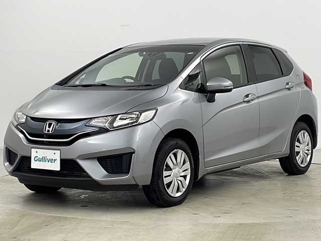 ホンダ フィット 13G Fパッケージ 道央・札幌 2015(平27)年 2.8万km ティンテッドシルバーM ・4WD/・ワンオーナー/・純正ナビ＆TV&CD&DVD&BT&SD/・バックカメラ/・衝突軽減ブレーキ/・純正ドライブレコーダー/・純正エンジンスターター/・鉄チン付きサマータイヤ積込/・フロントワイパーデアイサー/・ビルトインETC/・スマートキー/・スペアキー/・アイドリングストップ/・横滑り防止