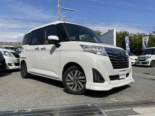 トヨタ ルーミー カスタムG 兵庫県 2018(平30)年 10.6万km パールホワイトⅢ (株)IDOMが運営する【じしゃロン西宮店】の自社ローン専用車両になります。こちらは現金またはオートローンご利用時の価格です。自社ローンご希望の方は別途その旨お申付け下さい/＊ETC/＊バックカメラ/＊パワステ/＊パワーウィンドウ/＊アイドリングストップ/＊クルーズコントロールあり/＊フルセグ/＊シートヒーター/＊両側パワスラ/＊横滑り防止装置/＊オートライト/＊LEDライト