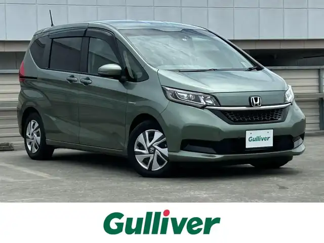 ホンダ フリード ハイブリット G ホンダセンシング 静岡県 2021(令3)年 1.4万km シルバーミストグリーンM 純正メモリナビ /フルセグTV /バックカメラ /ACC/ビルトインETC/USB充電/Bluetooth/CD/DVD再生あり /ホンダセンシング/両側電動スライドドア /シートヒーター /アイドリングストップ /スマートキー/アクティブコーナリングライト/LEDヘッドライト/Cパッケージ