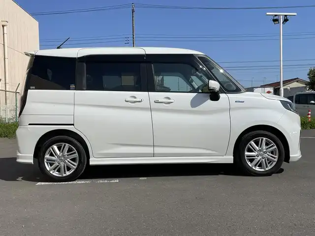 スズキ ソリオ HV MZ 東京都 2023(令5)年 4.2万km ピュアホワイトP ケンウッドナビ/バックモニター/デュアルカメラブレーキサポート/車線逸脱警報機能/パーキングソナー/シートヒーター/アダプティブクルーズ/両側電動スライドドア/横滑り防止措置/スマートキー