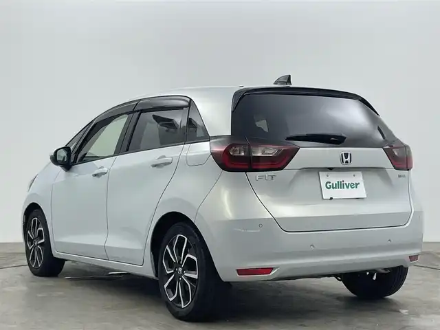 ホンダ フィット e:HEVホーム 岡山県 2020(令2)年 1.5万km プレミアムサンライトホワイトパール 純正９インチナビ/【Bluetooth/フルセグTV/USB】/純正16インチAW(オプション）/ハーフレザーシート/衝突軽減ブレーキ/追従型クルーズコントロール/ビルトインＥＴＣ/ＬＥＤヘッドライト＆LEDフォグランプ/オートハイビーム　/純正ドライブレコーダー（前後）/バックカメラ/純正フロアマット/踏み間違い防止/オートブレーキホールド/ISOFIX/ステアリングスイッチ/チルトステアリング/シートリフター/ウインカーミラー/ドアバイザー/プッシュスタート/スマートキー×2/保証書/取扱説明書/ナビ取扱説明書
