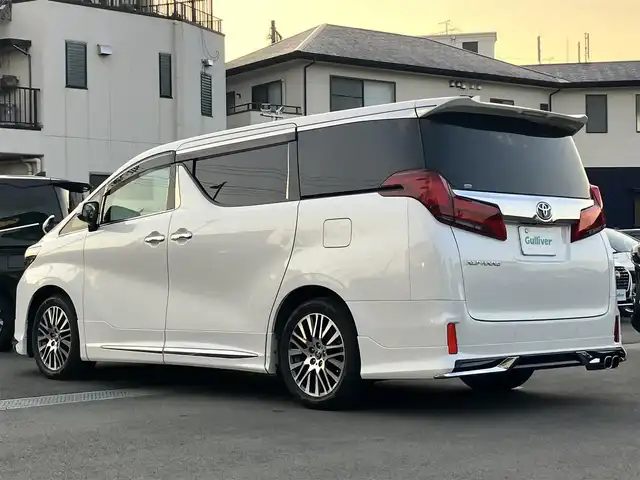 トヨタ アルファード S 静岡県 2021(令3)年 5.7万km ホワイトパールクリスタルシャイン モデリスタフルエアローセット/リアドアレスアップマフラー/ワンオーナー/エンジンスタートボタン/パワーステアリング/パワーウィンドウ/100V充電/スマートキー/Wオートエアコン/スペアキー1本/レーダークルーズコントロール/純正１３．３インチ後席モニター/純正10.5インチナビ（DVD/BT/フルセグ）/バックカメラ/USB入力端子/ETC/三列シート/オットマン/ウォークスルー/純正フロアマット/純正アルミホイール/布シート/両側パワースライドドア/ABS/横滑り防止装置/コーナーセンサー前後/レーンキープアシスト/盗難防止装置/オートライト/オートマチックハイビーム/LEDヘッドライト/W+サイドエアバッグ/カーテンエアバッグ