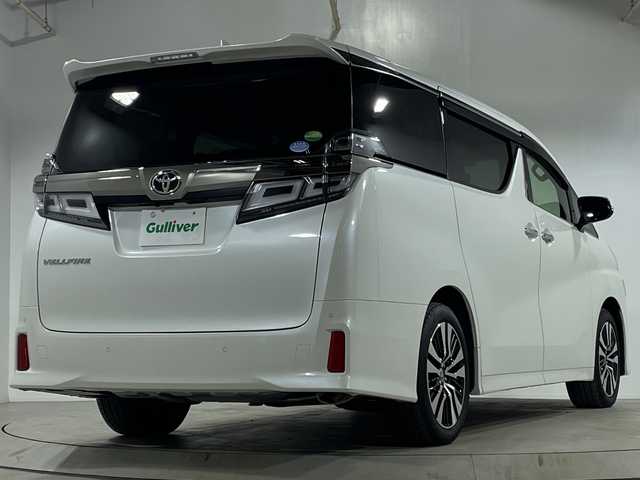 トヨタ ヴェルファイア Z Gエディション 宮城県 2019(令1)年 1.3万km ホワイトパールクリスタルシャイン ワンオーナー車/純正10インチナビ【NSZN-Z68T】/AM FM フルセグTV Bluetooth CD DVD/バックカメラ/両側パワースライドドア/セーフティセンス/レーダークルーズコントロール/前席シートヒーター＋パワーシート/運転席シートメモリー機能/ビルトインETC2.0/前側ドライブレコーダー/純正フロアマット/ステアリングヒーター/革巻きステアリング/ステアリングスイッチ/パワーバックドア/電動パーキングブレーキ/ブレーキオートホールド/プッシュスタート/スマートキー/スペアキー1本/取扱説明書/保証書/助手席・2列目オットマン/LEDヘッドライト/オートマチックハイビーム/純正18インチアルミホイール/ドアバイザー/電動格納ミラー/プリクラッシュセーフティ/レーントレーシングアシスト/ロードサインアシスト