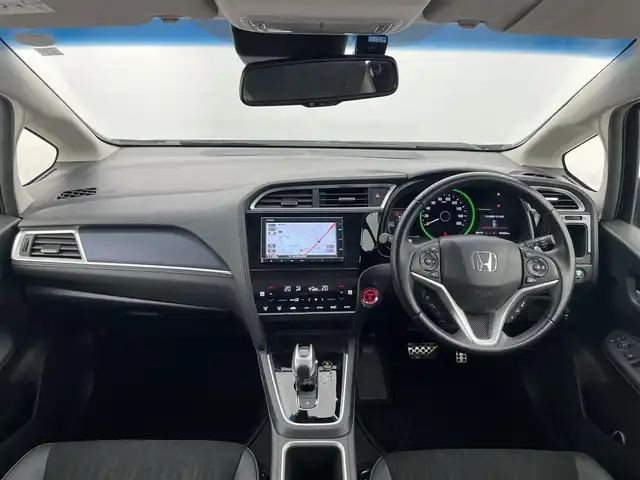 ホンダ シャトル ハイブリッド X ホンダセンシング 富山県 2019(令1)年 3.1万km ミッドナイトブルービームM 純正ナビ（AM/FM/CD/BT/USB）/バックカメラ/ドライブレコーダー/ETC/ハーフレザーシート/シートヒーター/衝突被害軽減システム/レーダークルーズコントロール/レーンキープアシスト/横滑り防止装置/アイドリングストップ/オートLEDライト/フォグライト/純正アルミホイール/純正フロアマット/革巻きステアリング/ステアリングスイッチ/パドルシフト/スマートキー