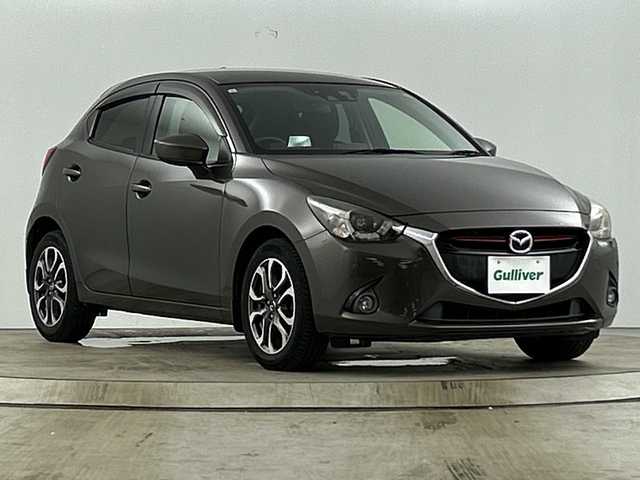 マツダ デミオ XD ツーリング 愛知県 2015(平27)年 6.6万km チタニウムフラッシュマイカ 純正7インチナビ/（CD/DVD/Bluetooth/フルセグTV)/バックカメラ/衝突軽減ブレーキ/ブラインドスポットモニター/クルーズコントロール/ETC/純正16インチアルミホイール/スマートキー/スペアキー１本/オートライト/純正フロアマット/USB端子