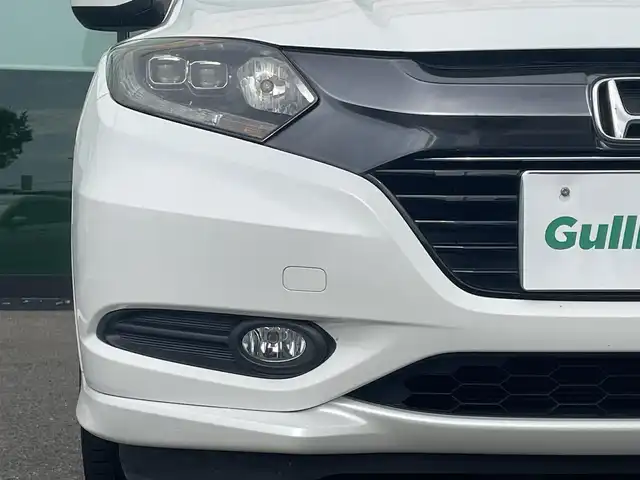ホンダ ヴェゼル ハイブリッド Z 和歌山県 2016(平28)年 8.6万km ホワイトオーキッドパール 社外7インチナビ（MDV-Z701）/バックカメラ/フルセグTV/BT/HDMI/KENWOODツイーター/衝突軽減ブレーキ/クルーズコントロール/オートライト/横滑り防止/ドラレコ/ETC/シートヒーター/ハーフレザーシート/ルーフレール/LEDヘッドライト/フォグランプ/パドルシフト