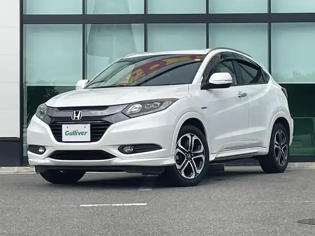 ホンダ ヴェゼル ハイブリッド Z 和歌山県 2016(平28)年 8.6万km ホワイトオーキッドパール 社外7インチナビ（MDV-Z701）/バックカメラ/フルセグTV/BT/HDMI/KENWOODツイーター/衝突軽減ブレーキ/クルーズコントロール/オートライト/横滑り防止/ドラレコ/ETC/シートヒーター/ハーフレザーシート/ルーフレール/LEDヘッドライト/フォグランプ/パドルシフト