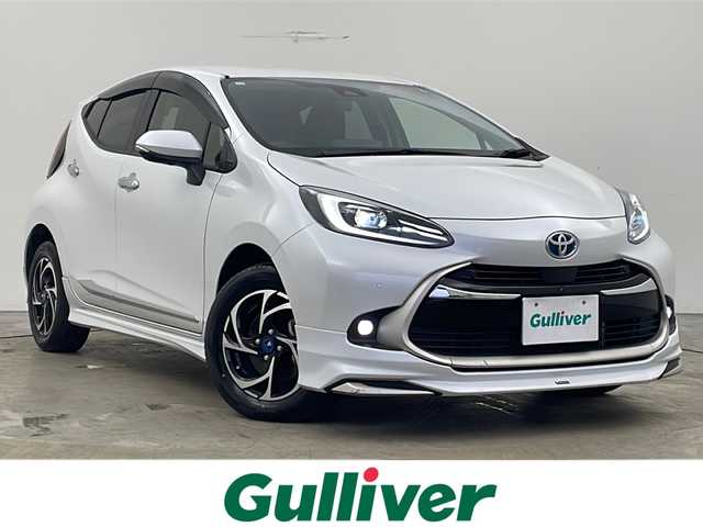 トヨタ アクア Z 秋田県 2023(令5)年 0.8万km プラチナホワイトパールマイカ 4WD/寒冷地仕様/セーフティセンス/モデリスタエアロ/純正ナビ /フルセグTV/パーキングサポートブレーキ /レーダークルーズコントロール /モデリスタAW　/全方位カメラ　/バックカメラ/運転席パワーシート /ステアリングヒーター /ライトレベライザー/フロントワイパーデアイサー/ライトレベライザー/横滑り防止装置/PCTA/AC100V/オートマチックハイビーム/オートライト/プッシュスタート/USBポート/クリアランスソナー/衝突被害軽減システム/前席シートヒーター/ハーフレザーシート/スマートキー/スペアキー有/レーンキープアシスト/ステアリングリモコン/革巻きステアリング/電格ミラー/純正フロアマット/コーナーセンサー