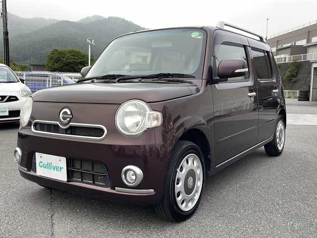 ダイハツ ミラ ココア プラスX 山梨県 2013(平25)年 6.1万km プラムブラウンクリスタルマイカ 社外ＳＤナビ　/ＡＢＳ　/盗難防止装置　/ハロゲンヘッドライト　/運転席／助手席エアバッグ　/パワーステアリング　/パワーウインドウ　/アイドリングストップ　/リモコンキー　/オートエアコン　/布シート　/ルーフレール
