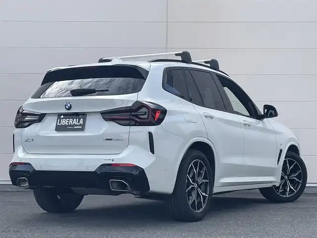ＢＭＷ Ｘ３ xDrive20d Mスポーツ 岡山県 2022(令4)年 4.6万km アルピンホワイトⅢ HUD/純正iDrive7/アラウンドビューカメラ/モカブラウンレザーシート/シートヒーター/パワーシート/ACC/オートライト/オートハイビーム/レインセンサー/PDC/パーキングアシスト/ライトカーペット/正面衝突警告/側面衝突警告/車線逸脱警告/ステアリングサポート/車線変更警告/パドルシフト/アップルカープレイ/ミラー一体型ETC/BMW純正ルーフキャリア/ドラレコ（F/R）
