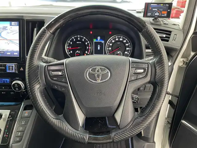 トヨタ ヴェルファイア Z Gエディション 滋賀県 2016(平28)年 6万km ホワイトパールクリスタルシャイン ALPINE10インチナビ/CD/DVD/USB/Bluetooth/HDMI/フルセグテレビ/ツインムーンルーフ/ALPINEC12.8インチフリップダウンモニター/クルーズコントロール/クリアランスソナー/両側パワースライドドア/パワーバックドア/エアロパーツ/ETC/LEDヘッドライト/LEDフォグランプ/ハーフレザーシート/D/N席パワーシート/ステアリングヒーター/前後ドライブレコーダー/プッシュスタート /スマートキー/社外マフラー