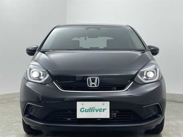 ホンダ フィット e:HEVホーム 岡山県 2021(令3)年 3.2万km クリスタルブラックパール 純正８インチSDナビ/【Bluetooth/フルセグTV/USB接続】/衝突軽減ブレーキ/追従型クルーズコントロール/ビルトインＥＴＣ/ＬＥＤヘッドライト/オートハイビーム/バックカメラ/純正ドライブレコーダー（前後）/踏み間違い防止/オートブレーキホールド/ISOFIX/ステアリングスイッチ/チルトステアリング/シートリフター/ウインカーミラー/ドアバイザー/スマートキー×2