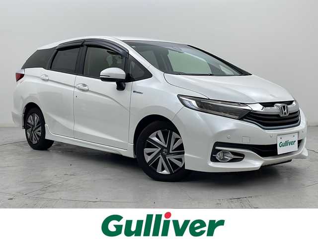 ホンダ シャトル ハイブリッド X 宮城県 2016(平28)年 7.5万km ホワイトオーキッドパール 禁煙車/あんしんパッケージ/・シティブレーキアクティブシステム/・サイドカーテンエアバッグシステム/クルーズコントロール/純正7型ナビ/・BT.CD.DVD.SD/・ワンセグTV/バックカメラ/ハーフレザシート/ビルトインETC/ドライブレコーダー（FR）/LEDヘッドライト/フォグライト/プッシュスタート/スマートキー×2/横滑り防止/パドルシフト/純正フロアマット/ドアバイザー