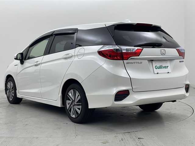 ホンダ シャトル ハイブリッド X 宮城県 2016(平28)年 7.5万km ホワイトオーキッドパール 禁煙車/あんしんパッケージ/・シティブレーキアクティブシステム/・サイドカーテンエアバッグシステム/クルーズコントロール/純正7型ナビ/・BT.CD.DVD.SD/・ワンセグTV/バックカメラ/ハーフレザシート/ビルトインETC/ドライブレコーダー（FR）/LEDヘッドライト/フォグライト/プッシュスタート/スマートキー×2/横滑り防止/パドルシフト/純正フロアマット/ドアバイザー