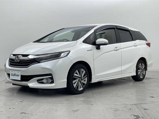 ホンダ シャトル ハイブリッド X 宮城県 2016(平28)年 7.5万km ホワイトオーキッドパール 禁煙車/あんしんパッケージ/・シティブレーキアクティブシステム/・サイドカーテンエアバッグシステム/クルーズコントロール/純正7型ナビ/・BT.CD.DVD.SD/・ワンセグTV/バックカメラ/ハーフレザシート/ビルトインETC/ドライブレコーダー（FR）/LEDヘッドライト/フォグライト/プッシュスタート/スマートキー×2/横滑り防止/パドルシフト/純正フロアマット/ドアバイザー