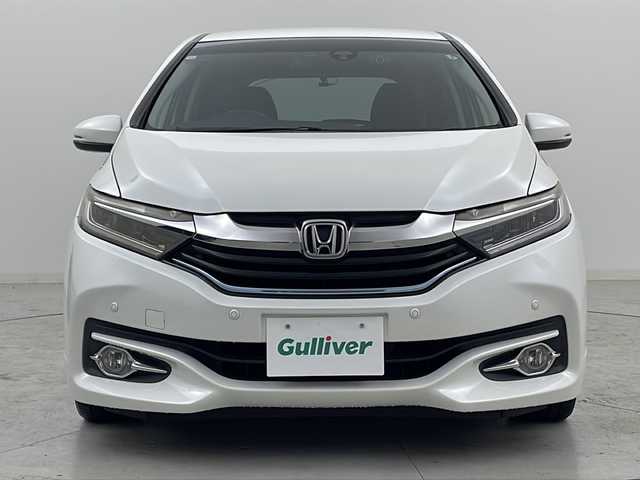 ホンダ シャトル ハイブリッド X 宮城県 2016(平28)年 7.5万km ホワイトオーキッドパール 禁煙車/あんしんパッケージ/・シティブレーキアクティブシステム/・サイドカーテンエアバッグシステム/クルーズコントロール/純正7型ナビ/・BT.CD.DVD.SD/・ワンセグTV/バックカメラ/ハーフレザシート/ビルトインETC/ドライブレコーダー（FR）/LEDヘッドライト/フォグライト/プッシュスタート/スマートキー×2/横滑り防止/パドルシフト/純正フロアマット/ドアバイザー