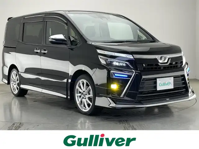 トヨタ ヴォクシー ZS 煌 愛知県 2018(平30)年 6.4万km ブラック 純正１０型ナビ　純正１２．１型後席モニター　モデリスタエアロ　バックカメラ　純正ドラレコ　クルーズコントロール　デジタルミラー型ドラレコ　セーフティセンス　衝突軽減　コーナーセンサー　ＬＥＤオートライト　レザー調シートカバー　ETC　禁煙車