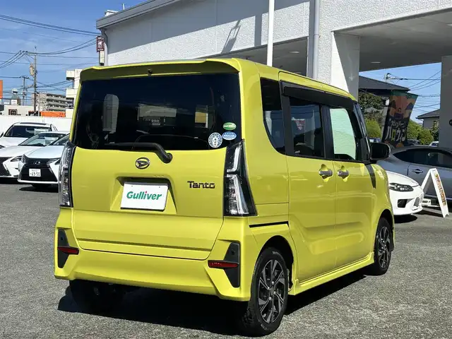 ダイハツ タント カスタム X 熊本県 2019(令1)年 5.8万km マスタードイエローマイカメタリック 純正9インチナビ（NSZN-Y69DS）/【フルセグTV/CD/DVD/Bluetooth】/バックカメラ/両側パワースライドドア/運転席ロングスライドシート/衝突軽減装置/コーナーセンサー/アイドリングストップ/純正15インチAW/前ドライブレコーダー/ビルトインETC/オートライト/電動格納ミラー/プッシュスタート/ステアリングスイッチ/フロアマット/ドアバイザー/横滑り防止/盗難防止装置/保証書/取扱説明書