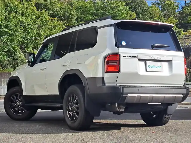 トヨタ ランドクルーザー ２５０ VX 大阪府 2024(令6)年 0.1万km プラチナホワイトパールマイカ /禁煙ワンオーナー//衝突被害軽減ブレーキ//サンルーフ/ルーフレール//純正12.3インチナビ機能付ディスプレイオーディオ//フルセグTV/BT/Miracast/HDMI/タイプC//全方位カメラ・バックカメラ//前後クリアランスソナー//ステアリングスイッチ//パワーバックドア//デジタルインナーミラー//レーンディパーチャーアラート//レーダークルーズコントロール//ブラインドスポットモニター//ビルトインETC2.0//DN席シートヒーター/エアシート//D席パワーシート//ステアリングヒーター//純正18AW//オートハイビーム