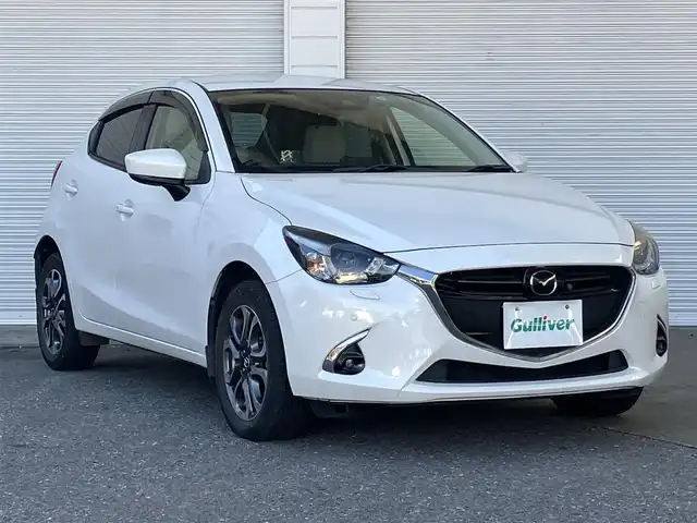 マツダ デミオ XD ツーリング Lパッケージ 高知県 2017(平29)年 2万km スノーフレイクホワイトパールマイカ 純正ナビ/Bluetooth接続/ETC/ターボ/ドライブレコーダー/全方位カメラ/純正フロアマット/純正16インチアルミホイール/フルセグテレビ/AAC/シートヒーター/横滑り防止装置/盗難防止装置/衝突被害軽減システム/LEDヘッドライト/AM/FM/本革巻きステアリング