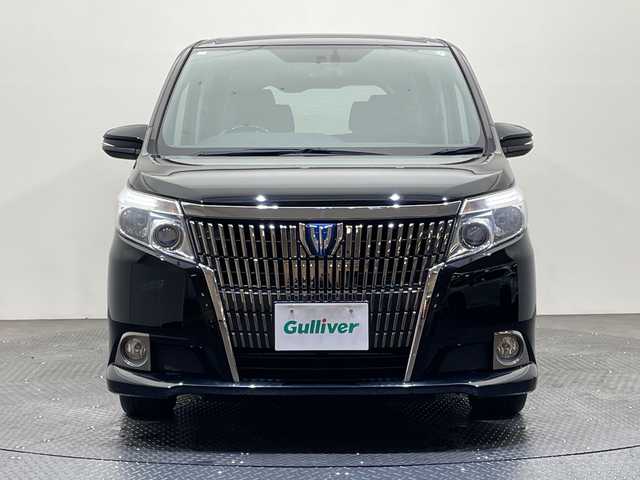 トヨタ エスクァイア ハイブリッド Gi 愛媛県 2015(平27)年 6.6万km ブラック 純正フリップダウンモニター/純正９型ナビ/フルセグTV　Bluetooth　DVD再生/バックカメラ/クルーズコントロール/両側電動スライドドア/レザーシート/クルーズコントロール/ドライブレコーダー/ＥＴＣ/おくだけ充電/シートヒーター/ＬＥＤ