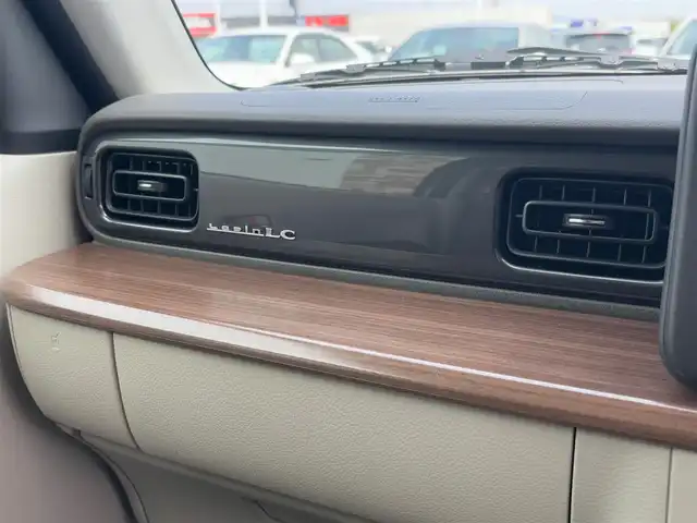 スズキ ラパン ＬＣ X 徳島県 2024(令6)年 0.5万km フォーンベージュM 純正ディスプレイオーディオ/ハーフレザーシート/シートヒーター/純正14インチアルミホイール/衝突被害軽減システム/レーンキープアシスト/横滑り防止装置/コーナーセンサー/バックカメラ/フロアマット/プッシュスタート/スマートキー