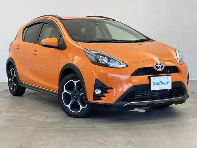 トヨタ アクア クロスオーバー 新潟県 2019(平31)年 1.5万km オレンジパールクリスタルシャイン 純正メモリナビ【NSZT-W68T】/　フルセグTV/Bluetooth/CD/DVD/トヨタセーフティセンス/・プリクラッシュセーフティ/・レーントレーシングアシスト/・レーンディパーチャーアラート/・レーダークルーズコントロール/・ロードサインアシスト/・オートマチックハイビーム/ハーフレザーシート/前席シートヒーター/前後コーナーセンサー/前後ドライブレコーダー/バックモニター/ビルトインETC/モデリスタアルミホイール/横滑り防止装置/LEDヘッドライト/オートマチックハイビーム/レザーステアリング/ステアリングスイッチ/禁煙車
