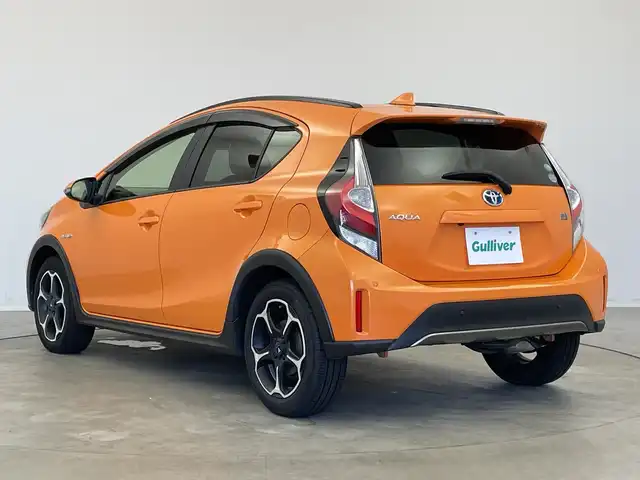 トヨタ アクア クロスオーバー 新潟県 2019(平31)年 1.5万km オレンジパールクリスタルシャイン 純正メモリナビ【NSZT-W68T】/　フルセグTV/Bluetooth/CD/DVD/トヨタセーフティセンス/・プリクラッシュセーフティ/・レーントレーシングアシスト/・レーンディパーチャーアラート/・レーダークルーズコントロール/・ロードサインアシスト/・オートマチックハイビーム/ハーフレザーシート/前席シートヒーター/前後コーナーセンサー/前後ドライブレコーダー/バックモニター/ビルトインETC/モデリスタアルミホイール/横滑り防止装置/LEDヘッドライト/オートマチックハイビーム/レザーステアリング/ステアリングスイッチ/禁煙車