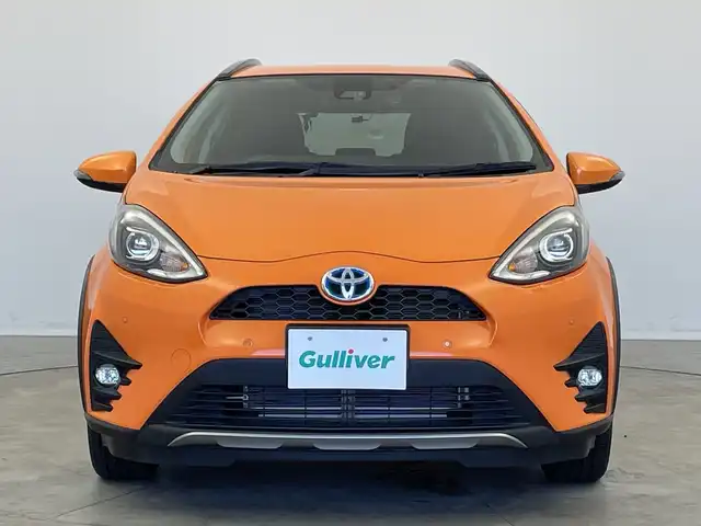 トヨタ アクア クロスオーバー 新潟県 2019(平31)年 1.5万km オレンジパールクリスタルシャイン 純正メモリナビ【NSZT-W68T】/　フルセグTV/Bluetooth/CD/DVD/トヨタセーフティセンス/・プリクラッシュセーフティ/・レーントレーシングアシスト/・レーンディパーチャーアラート/・レーダークルーズコントロール/・ロードサインアシスト/・オートマチックハイビーム/ハーフレザーシート/前席シートヒーター/前後コーナーセンサー/前後ドライブレコーダー/バックモニター/ビルトインETC/モデリスタアルミホイール/横滑り防止装置/LEDヘッドライト/オートマチックハイビーム/レザーステアリング/ステアリングスイッチ/禁煙車
