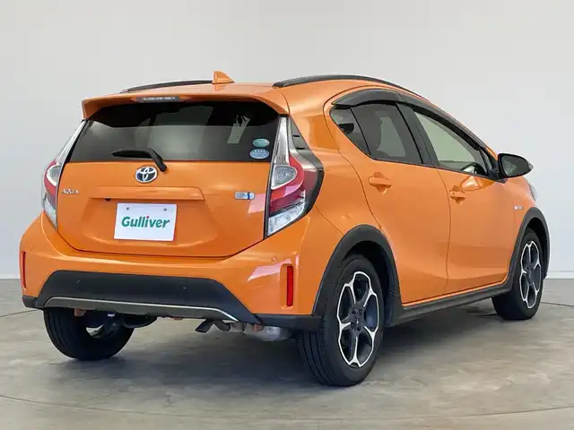 トヨタ アクア クロスオーバー 新潟県 2019(平31)年 1.5万km オレンジパールクリスタルシャイン 純正メモリナビ【NSZT-W68T】/　フルセグTV/Bluetooth/CD/DVD/トヨタセーフティセンス/・プリクラッシュセーフティ/・レーントレーシングアシスト/・レーンディパーチャーアラート/・レーダークルーズコントロール/・ロードサインアシスト/・オートマチックハイビーム/ハーフレザーシート/前席シートヒーター/前後コーナーセンサー/前後ドライブレコーダー/バックモニター/ビルトインETC/モデリスタアルミホイール/横滑り防止装置/LEDヘッドライト/オートマチックハイビーム/レザーステアリング/ステアリングスイッチ/禁煙車