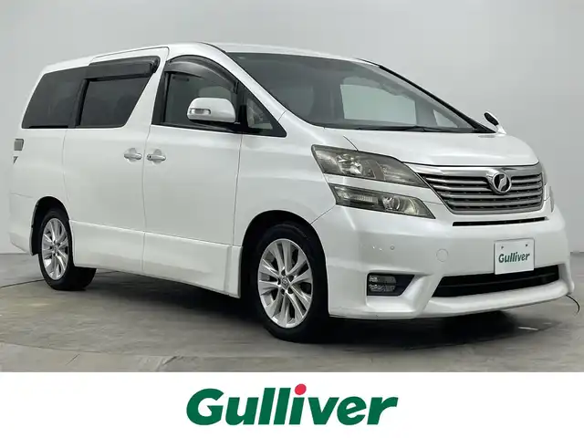 トヨタ ヴェルファイア 3．5Z 大分県 2009(平21)年 9.6万km ホワイトパールクリスタルシャイン 純正HDDナビ/（CD/DVD/Bluetooth）/バックカメラ/両側パワースライドドア/クルーズコントロール/ビルトインETC/クリアランスソナー/ウッドコンビステアリング/ステアリングスイッチ/スマートキープッシュスタート/純正アルミホイール/オートライト