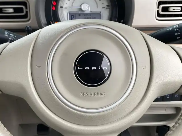 スズキ ラパン S 静岡県 2020(令2)年 1.8万km シフォンアイボリーM エンジンスタートボタン/パワーステアリング/パワーウィンドウ/アイドリングストップ/マニュアルエアコン/スマートキー/純正SDナビ（BT.ワンセグ）/D席シートヒーター/純正アルミホイール/ABS/横滑り防止装置/コーナーセンサー後のみ/レーンキープアシスト/オートライト/Wエアバック/衝突軽減システム